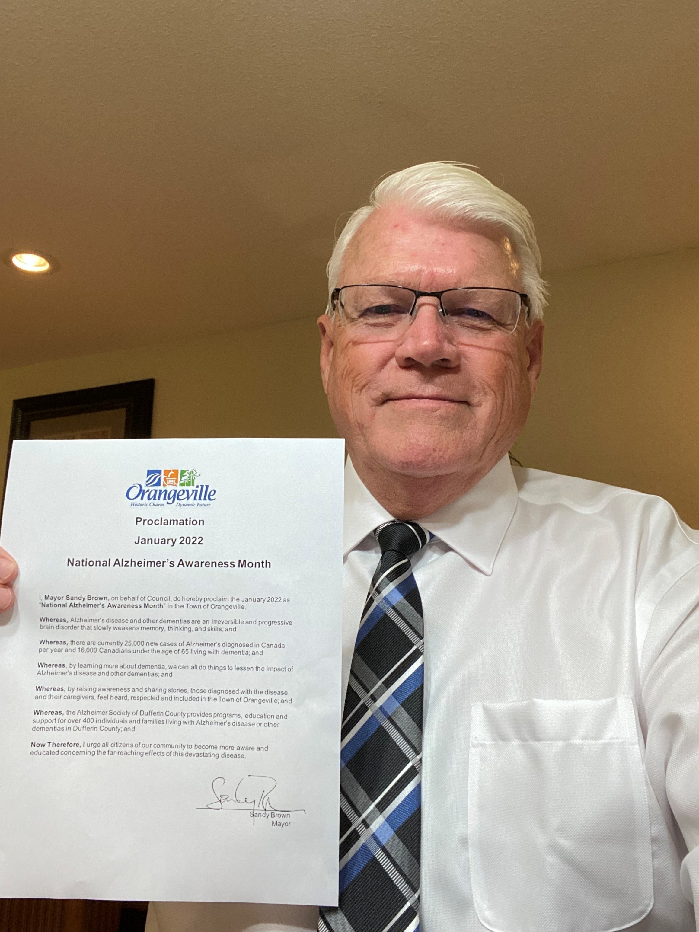 Orangeville Mayor Sandy Brown with the National Alzheimer's Awareness Month proclamation